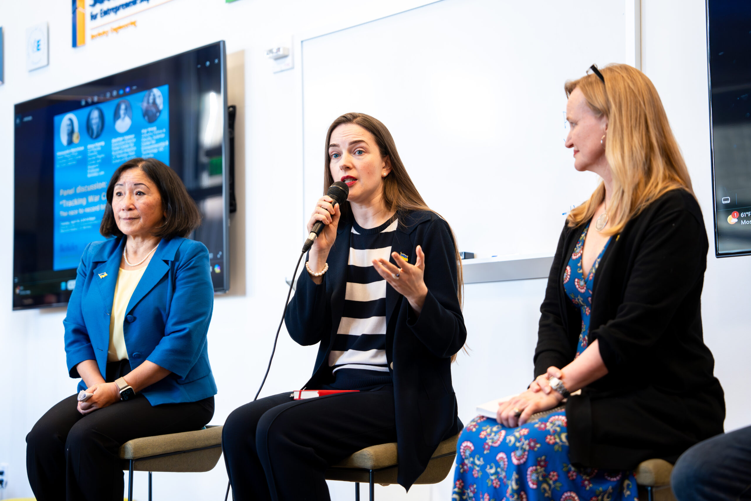 Speakers on the panel discuss "Tracking War Crimes in the AI Era." From left to right: Gigi Wang, Oleksandra Matviichuk and Alexa Koenig